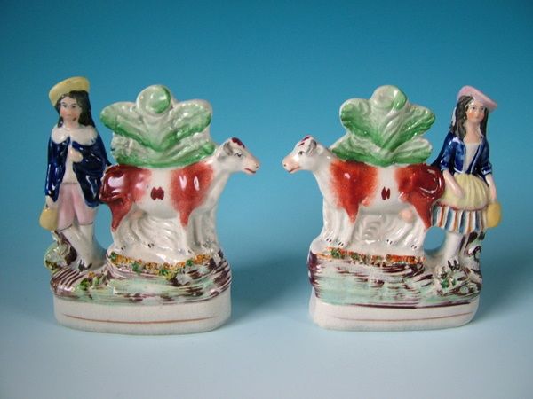 Pair Staffordshire cow & milkman/milkmaid figures  